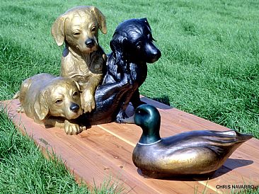SO THATS A DUCK  - Three Labrador puppies looking at their first duck which is a decoy by Chris Navarro