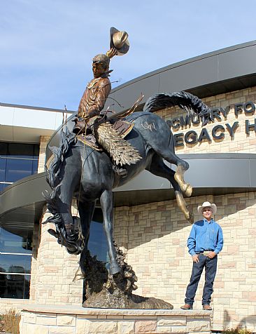 ''WYOMING COWBOY'' - Cowboy riding bucking horse  by Chris Navarro