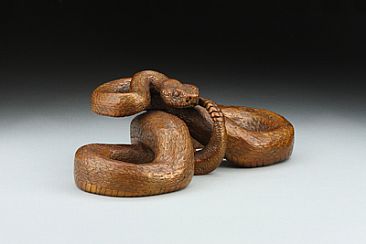 Space Invasion - Prairie Rattlesnake - Copper-colored patina by Eva Stanley